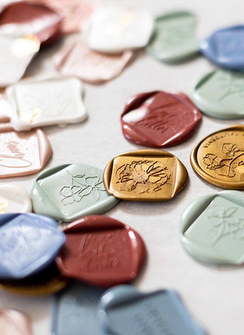Various wax seals in different colors.