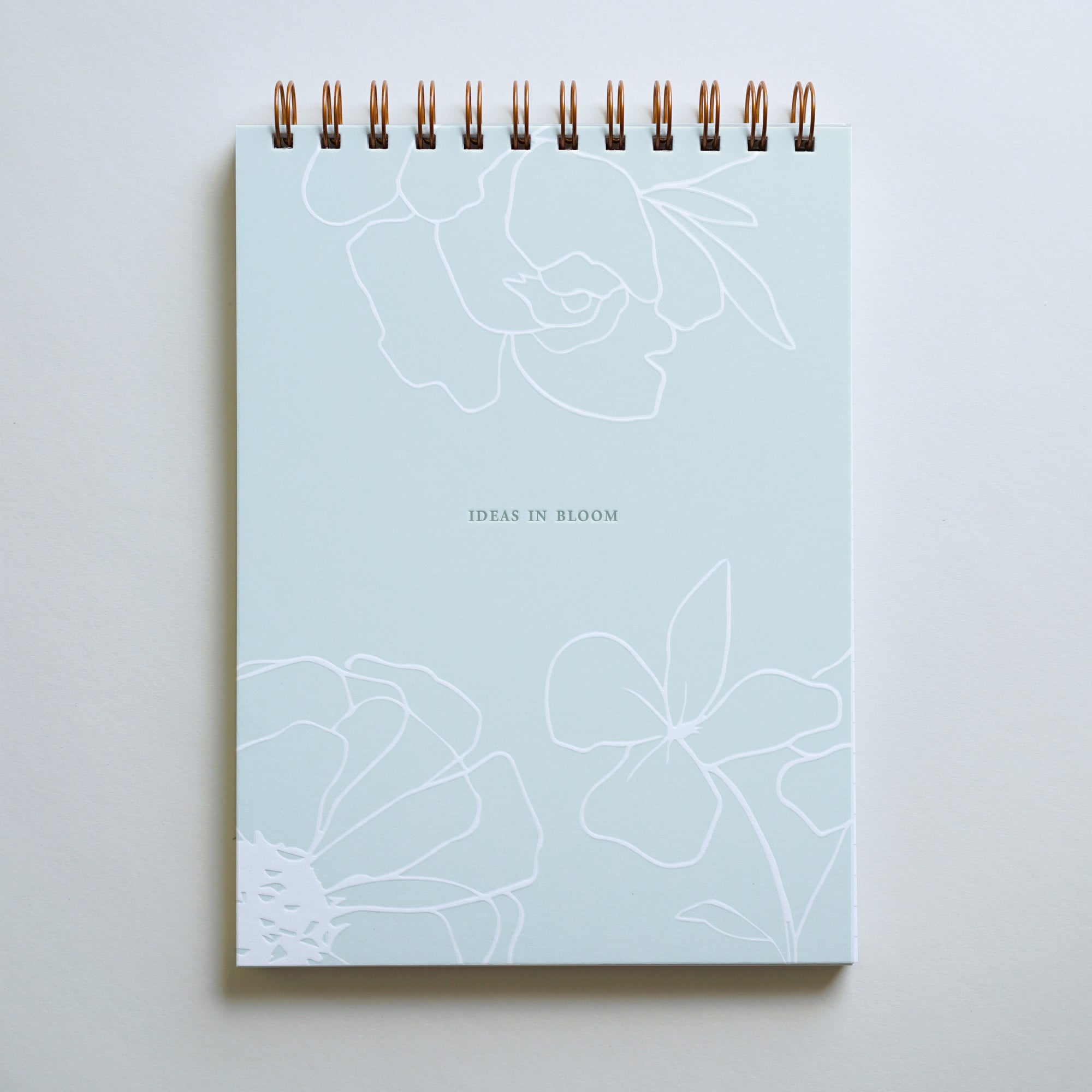 "Ideas In Bloom" lined notebook, letterpress printed by hand in sage ink.
